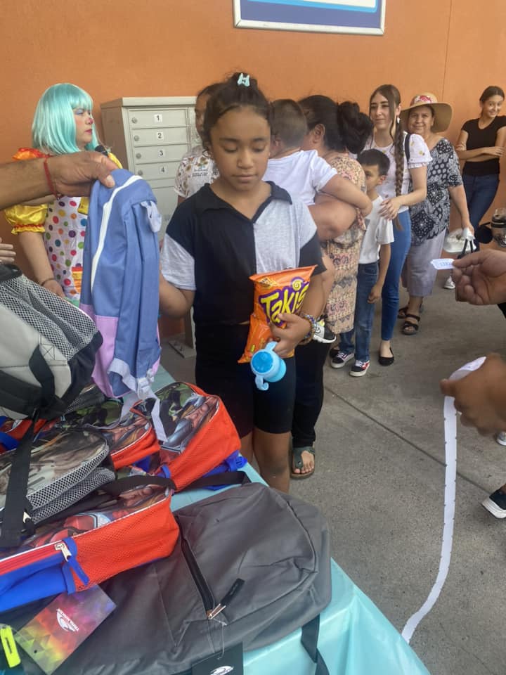 kids picking out new backpacks