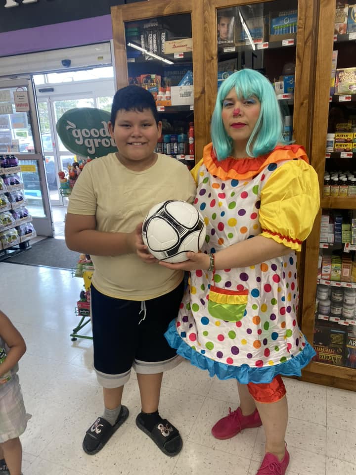 boy visiting with a clown